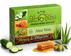 Aloe plus soap bar with packaging featuring aloe vera, honey, and olive oil on a white background.